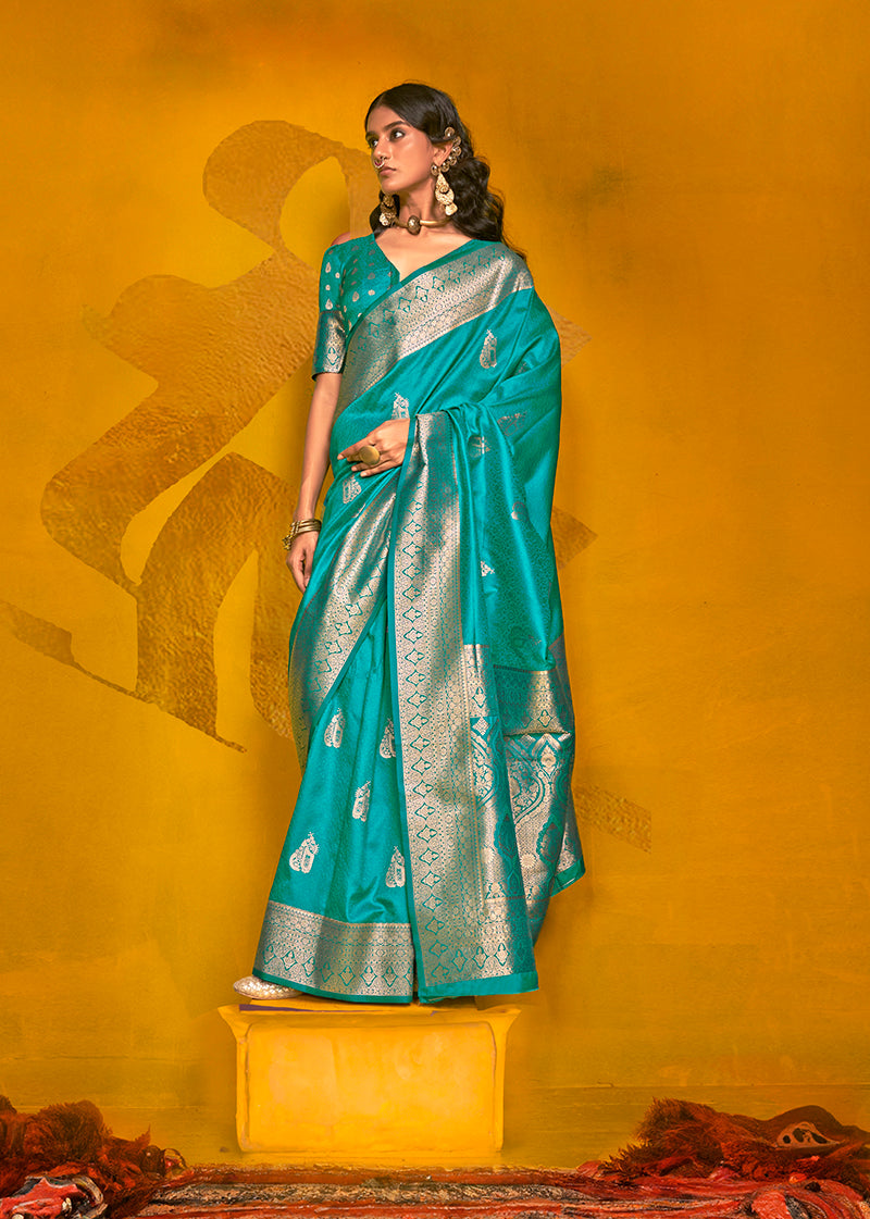 A beautiful cyan silk saree with detailed gold zari weaving and elegant border, ideal for formal occasions.