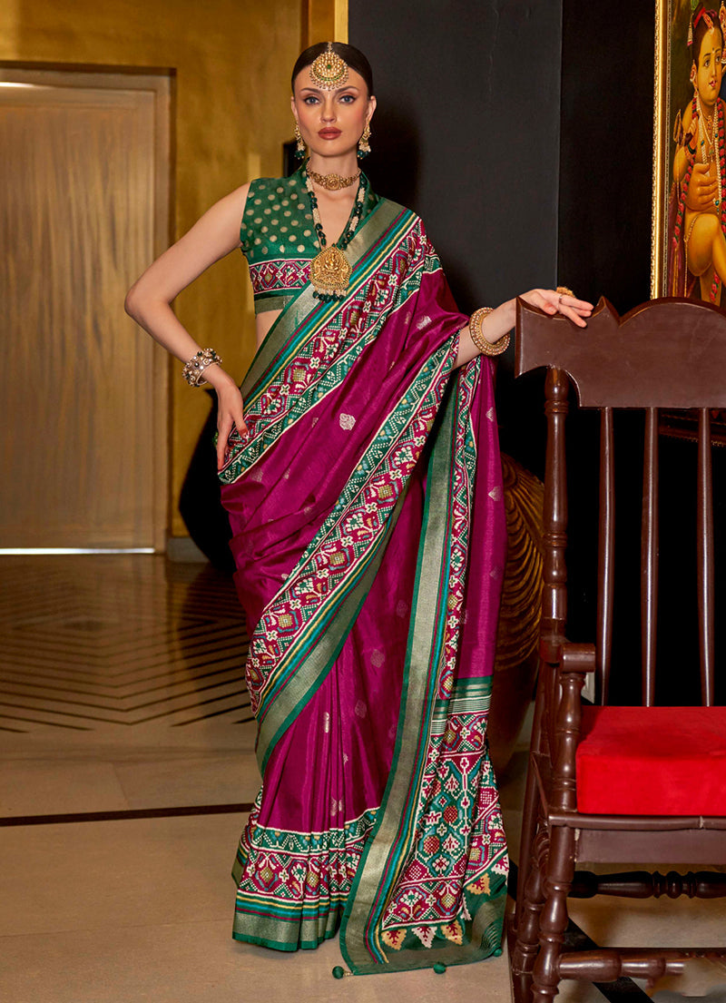 Burgundy silk saree with traditional Patola print for wedding ceremonies