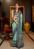 Sea green designer silk saree with Patola print details