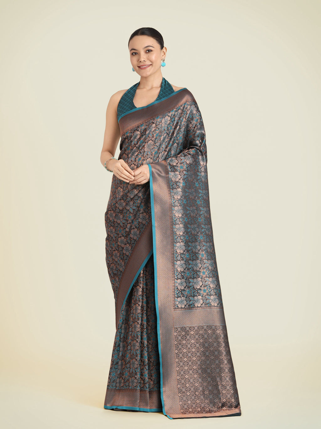 Teal color Banarasi silk woven saree featuring intricate golden zari work