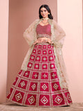 A front view of a rani-pink art silk A-line lehenga choli with geometric embroidery details.