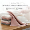 Gray 30x30cm corn fiber cleaning cloth folded on a neutral surface