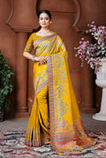 Golden Dola silk traditional saree with intricate woven details and a lustrous finish