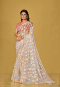 Off white organza brasso saree featuring beautiful floral prints