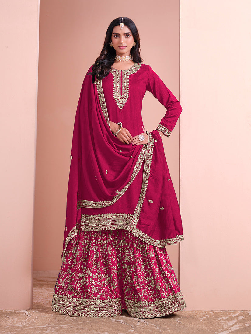 Rani-pink Art Silk salwar suit with detailed embroidery.