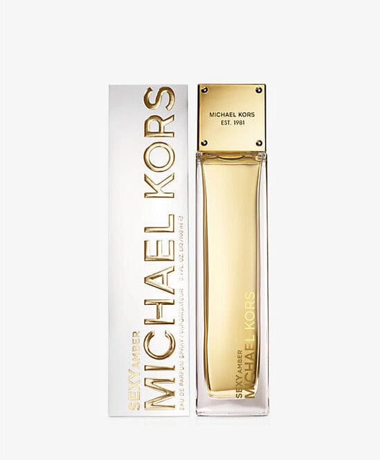 Michael Kors Sexy Amber 3.4 oz Eau de Parfum in a minimalist glass bottle with gold accents.