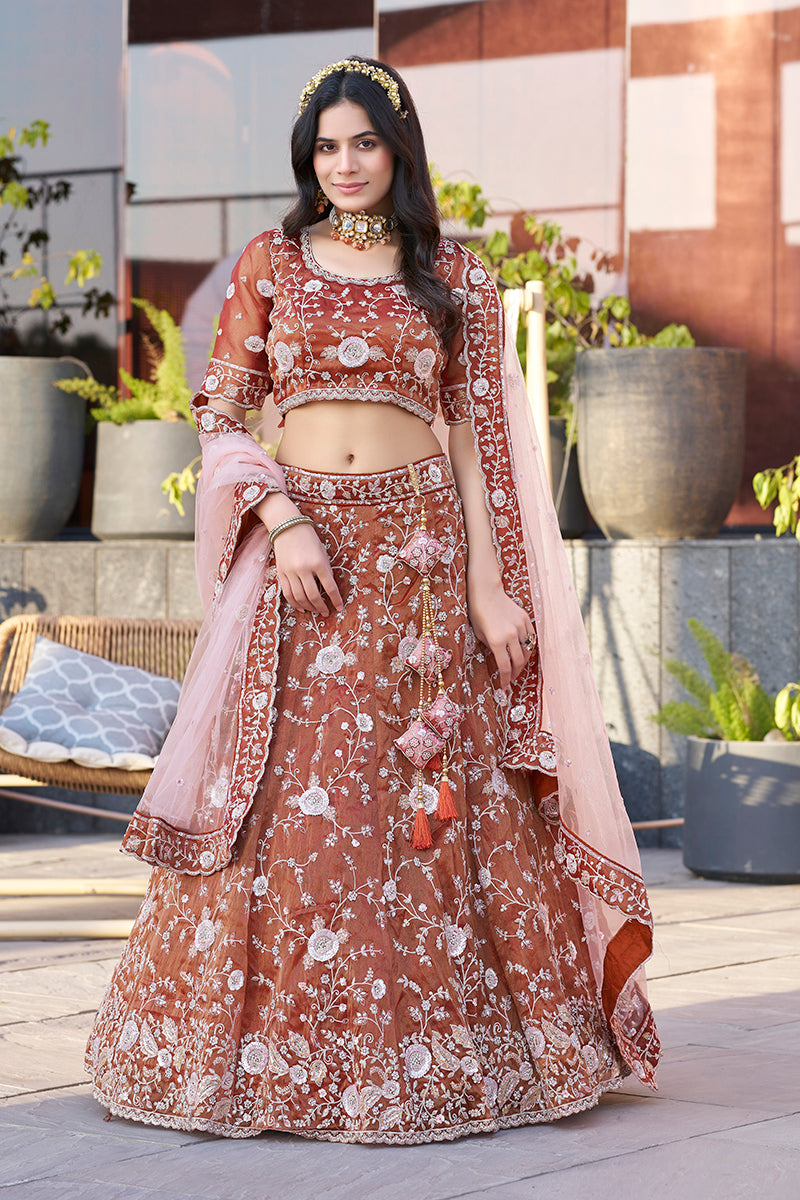 Dark orange art silk A-line lehenga choli with ornate embroidery.