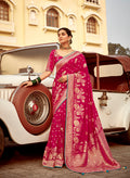Rani Pink wedding saree with traditional Banarasi weaving on Dola silk fabric
