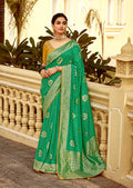 Emerald green Dola silk saree with a smooth, elegant drape for wedding occasions.