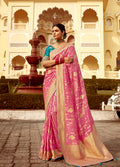 Rose Pink Dola silk wedding saree featuring intricate heavy golden Zari weaving