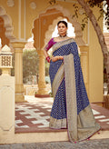 Navy blue Banarasi Dola silk wedding saree with intricate traditional weaving patterns.
