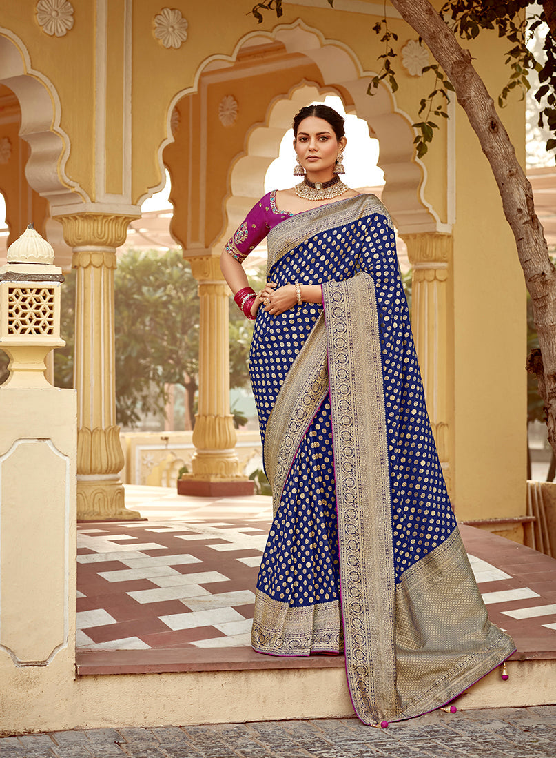 Navy blue Banarasi Dola silk wedding saree with intricate traditional weaving patterns.