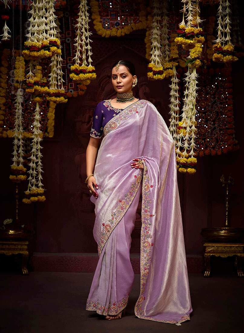 Lavender Kanjivaram silk saree with intricate zari weaving and delicate sequin embroidery