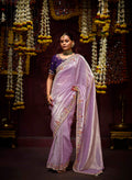 Lavender Kanjivaram silk saree with intricate zari weaving and delicate sequin embroidery