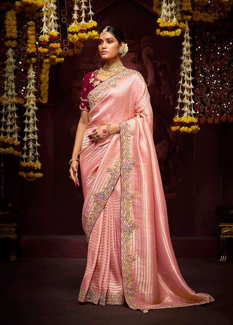 Rose pink Kanjivaram silk saree with intricate zari weaving and matching blouse