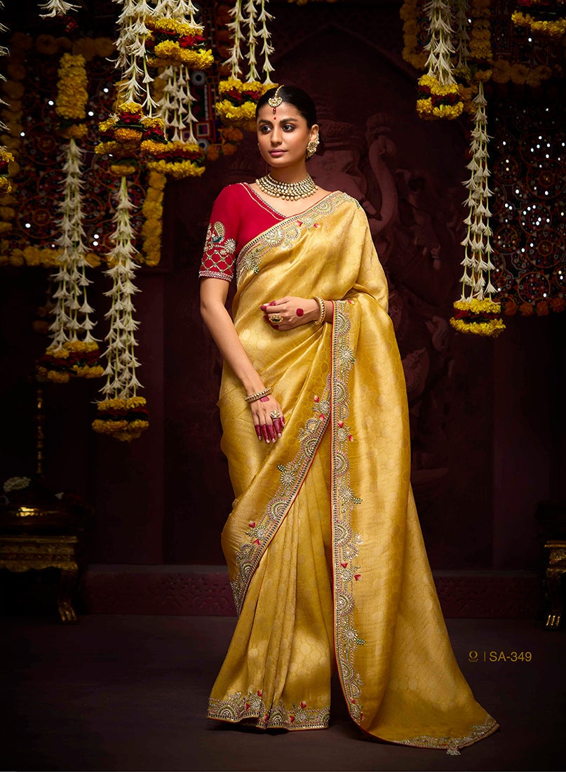 Mustard yellow Kanjivaram silk saree with intricate weaving and modern design.