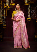 Purple and Pink traditional saree with gold zari work and sequins.