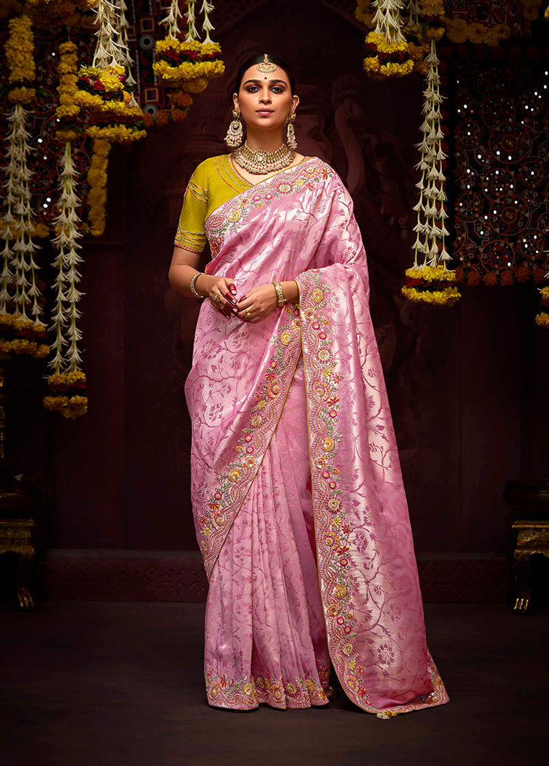 Purple and Pink traditional saree with gold zari work and sequins.