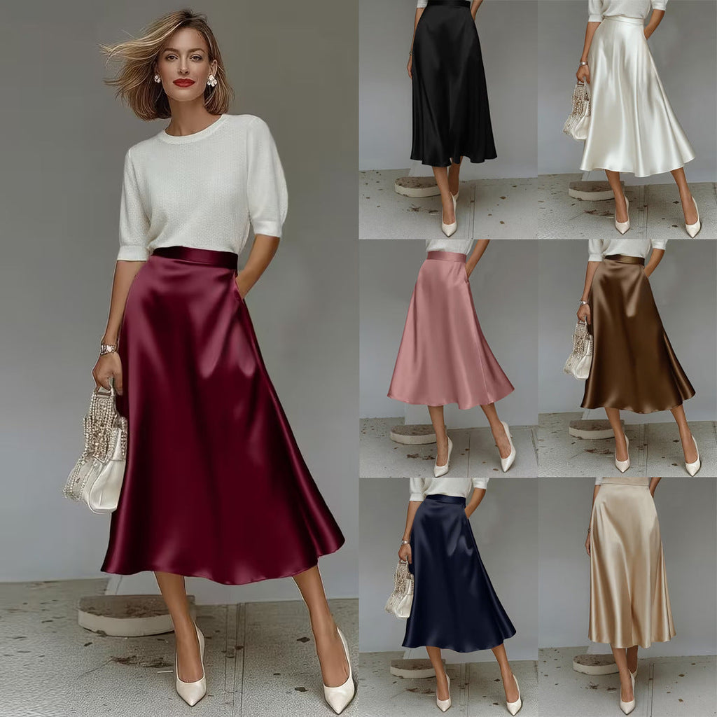 A woman wearing a solid color satin mid-length A-line skirt with a high-rise waist and a sleek, minimalist aesthetic.