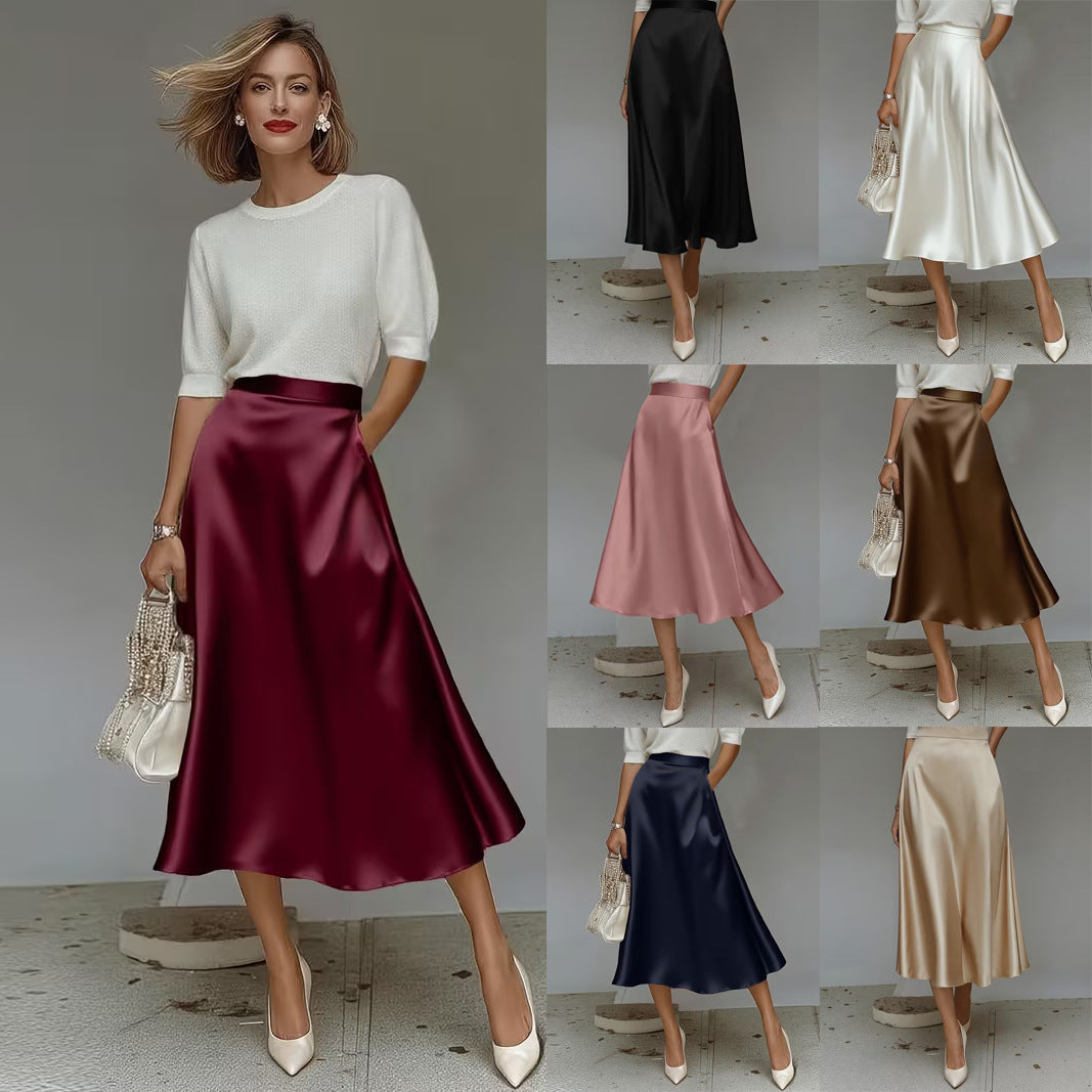 A woman wearing a solid color satin mid-length A-line skirt with a high-rise waist and a sleek, minimalist aesthetic.
