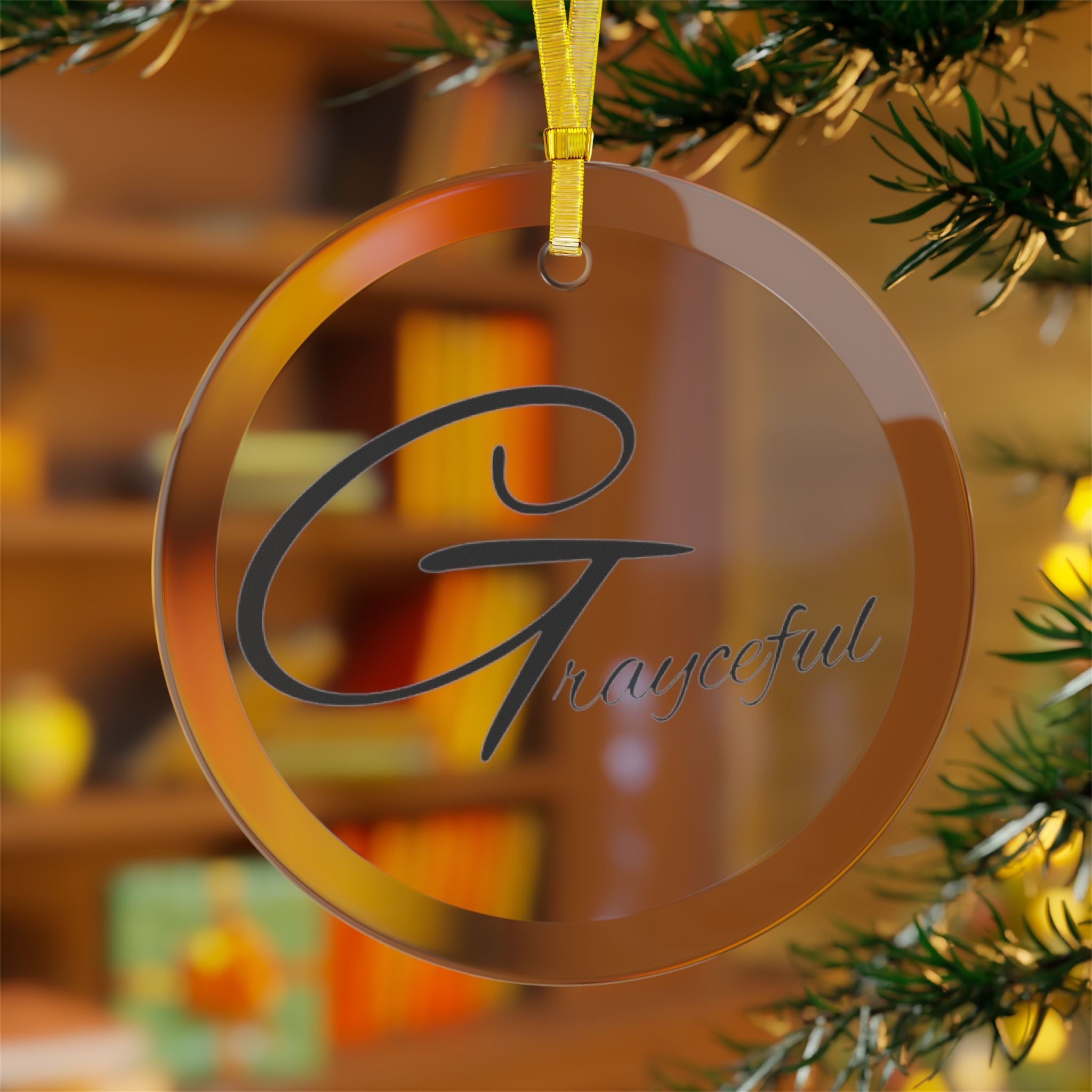 A 3.5-inch round glass ornament with custom artwork and a gold hanging ribbon.
