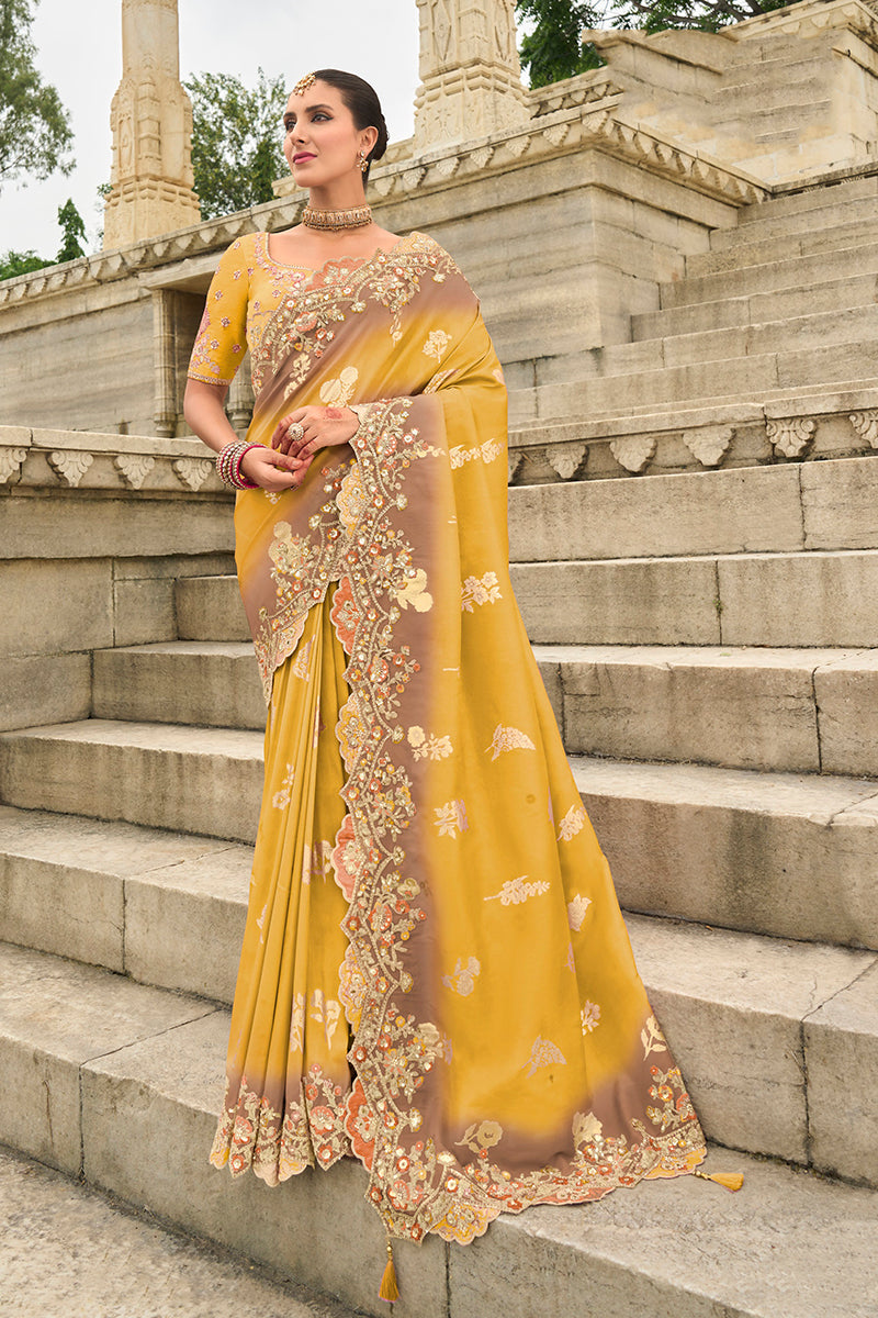 A beautiful yellow silk blend saree with intricate embroidery for festive occasions
