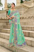 Turquoise classic saree with intricate cut-work on silk blend fabric