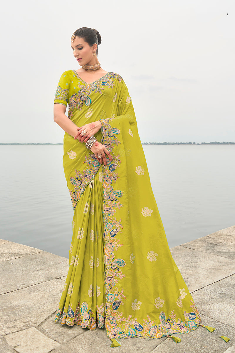 Elegant green designer saree with intricate embroidery in a silk blend fabric