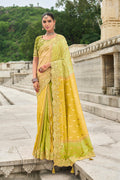 Green and yellow stone embellished silk blend traditional saree
