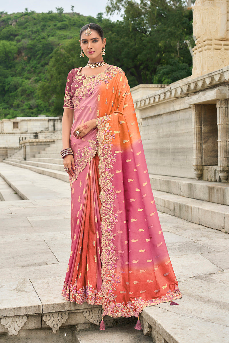 Pink and orange silk blend saree with traditional butti print details.
