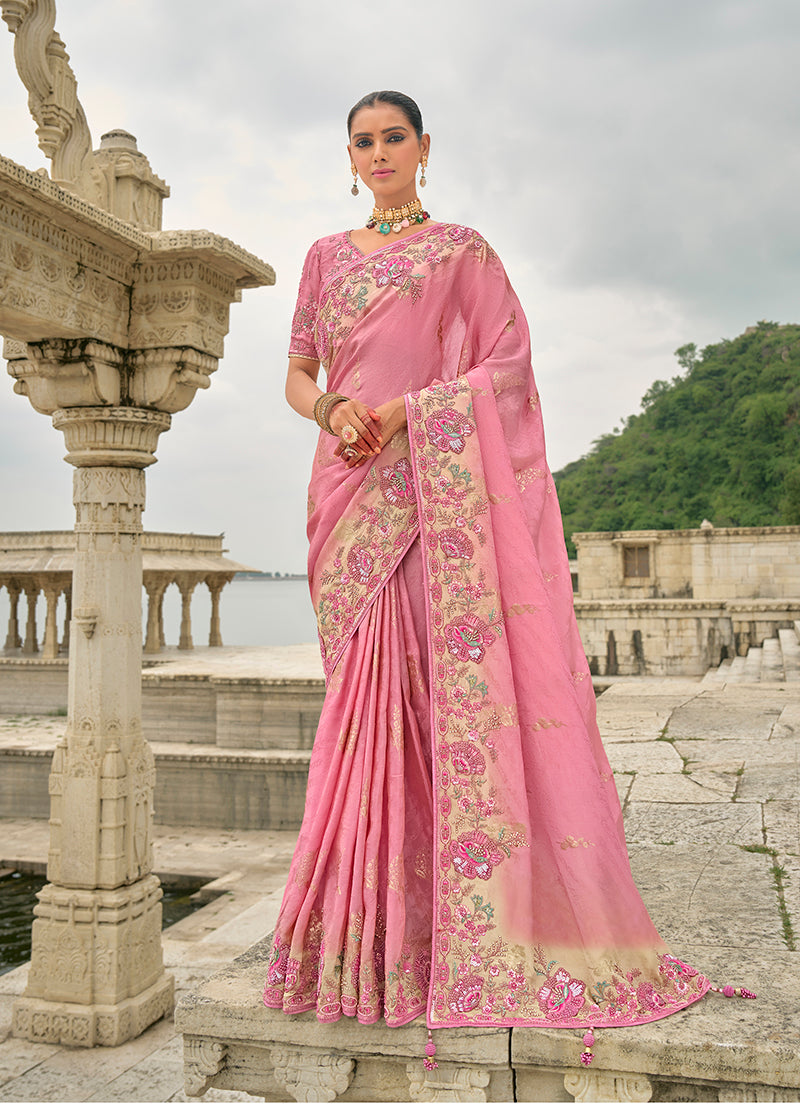 Pink Banarasi silk blend saree featuring detailed sequin embroidery and a heavy patchwork border.