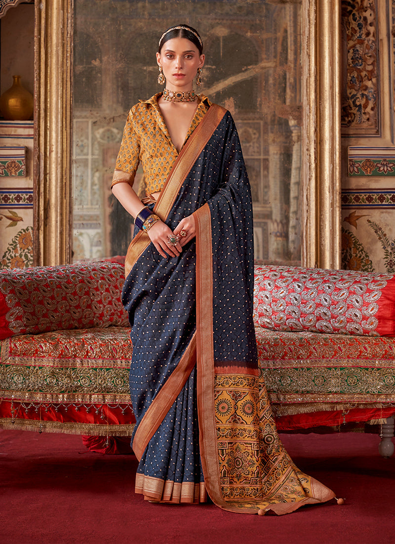 Elegant navy blue silk blend saree with modern printed patterns.