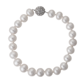A beautiful freshwater pearl bracelet with a sparkling crystal ball magnetic clasp against a white background.