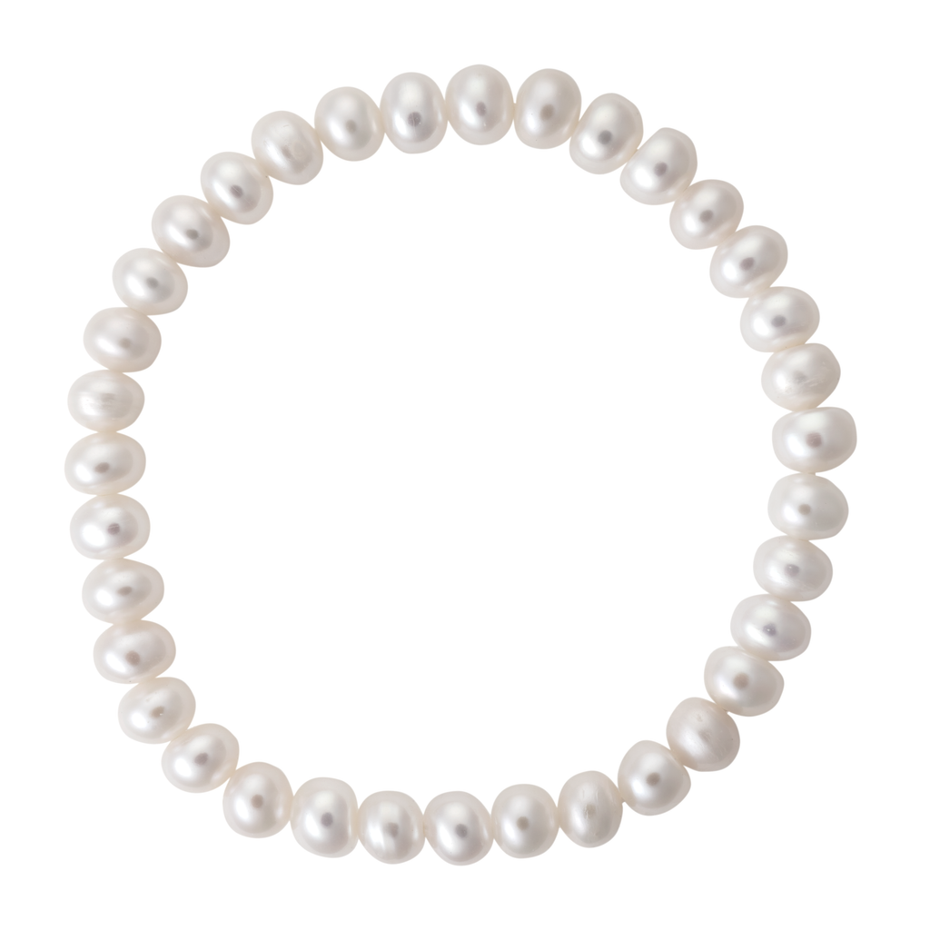 Young girl wearing a white freshwater pearl stretch bracelet on her wrist
