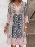 Blush pink midi dress with lace accents and patterned sleeves