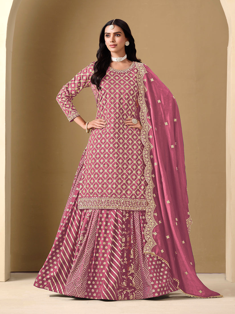 A beautiful pink Dola silk readymade lehenga choli with intricate jacquard work and embroidery.