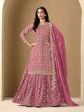 A beautiful pink Dola silk readymade lehenga choli with intricate jacquard work and embroidery.