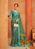 Aqua blue georgette printed saree with ethnic patterns for festival wear