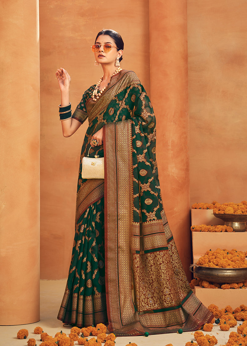 Dark green georgette designer saree with intricate zari woven patterns