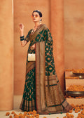 Dark green georgette designer saree with intricate zari woven patterns