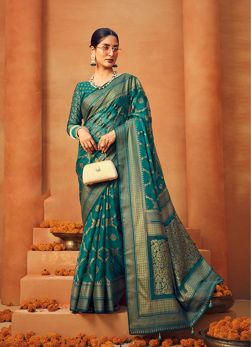 Teal georgette designer saree featuring detailed zari woven work