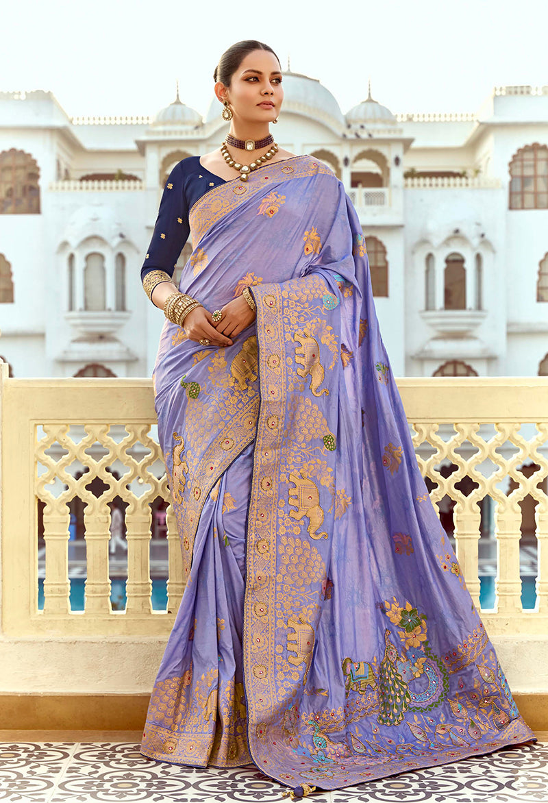Lavender silk blend traditional saree featuring Swarovski work and elegant weaving