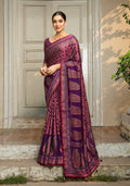 A beautiful purple georgette saree with classic prints, displayed on a mannequin.