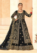 Model wearing a black embroidered velvet lehenga choli with intricate detail