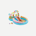 Colorful Candy Zone inflatable play center with a slide in a grassy backyard with two children playing.