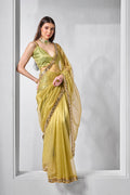 Luxury olive green and gold tissue net party wear saree