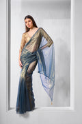Blue and gold party wear saree made from fancy tissue net fabric.
