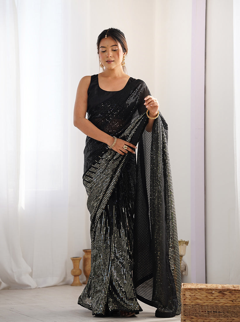 Elegant black georgette party wear saree with intricate sequins embellishments