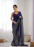 A beautiful blue georgette saree featuring detailed sequins work for party wear