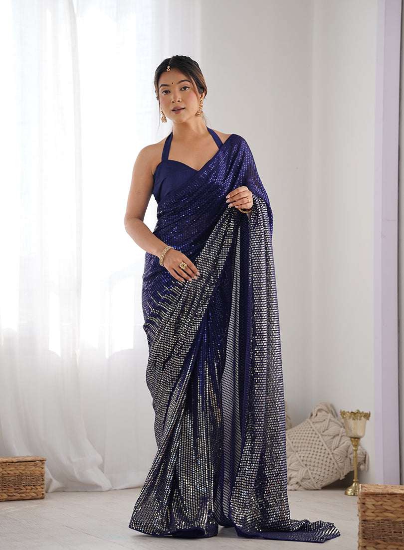 A beautiful blue georgette saree featuring detailed sequins work for party wear